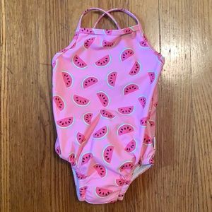 Infant swimsuit with built in diaper.